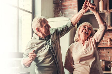 Elderly couple dancing as part of stroke prevention